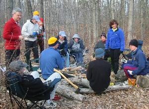 Group around the camp fire after running the first section of the MMT course